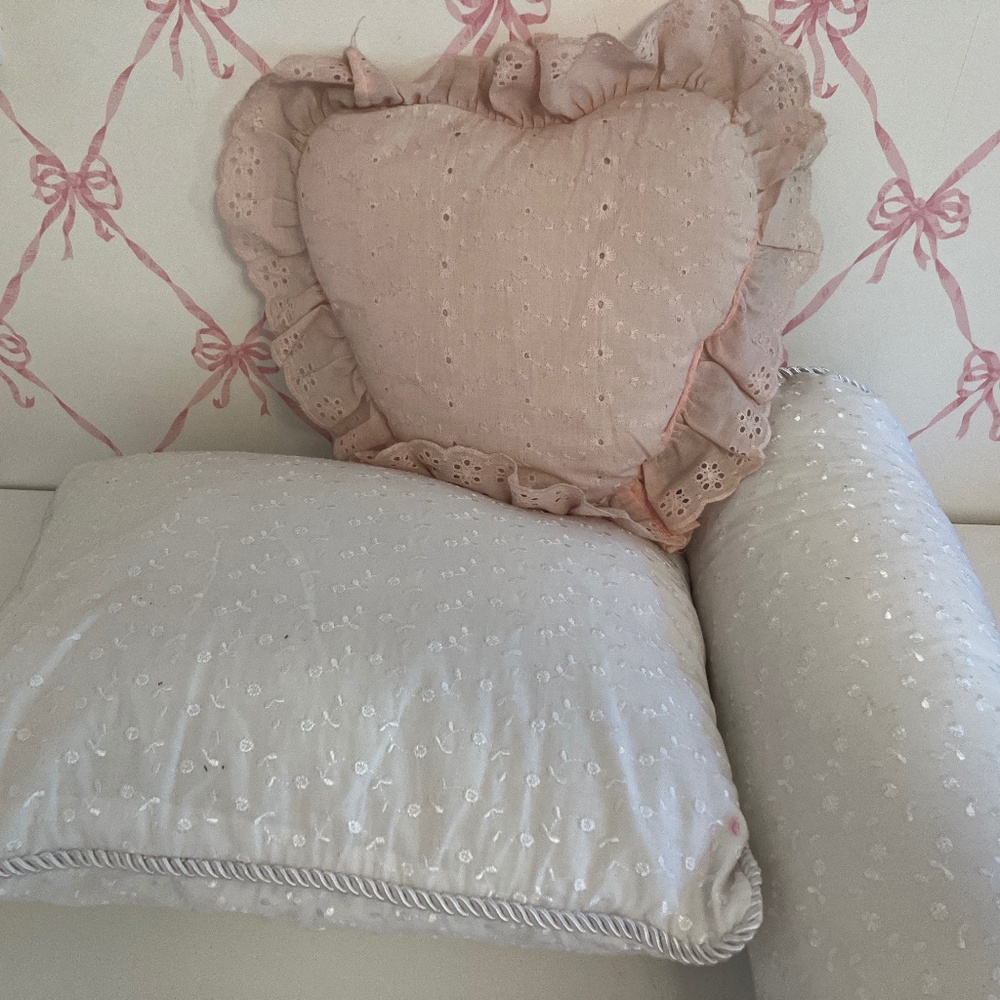 Selling three eyelid pillows. Two white, one pink.